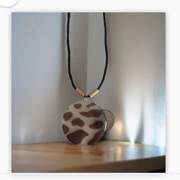 Brown cow pattern acrylic pendant necklace from Andrea and Me and Me Too at www.andreaandme.com