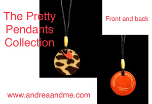 The Pretty Pendants Collection of handcrafted wood and acrylic pendant necklaces that are strung on a 19 inch black cord. The pendant is 2 inches round. Available at www.andreaandme.com