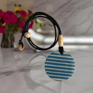 Handmade Boho Chic Wooden Pendant Necklace that is Blue and White Striped. Shop at www.andreaandme.com