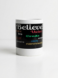 A front view of the white 11-ounce ceramic mug featuring a wide black wrap-around band. The word "Believe!" is prominently displayed at the top in large, white cursive script. Below it, the word is translated into various languages. The design is clean and inspirational, set against a bright, minimalist white background.   Shop www.ANDREAANDME.com
