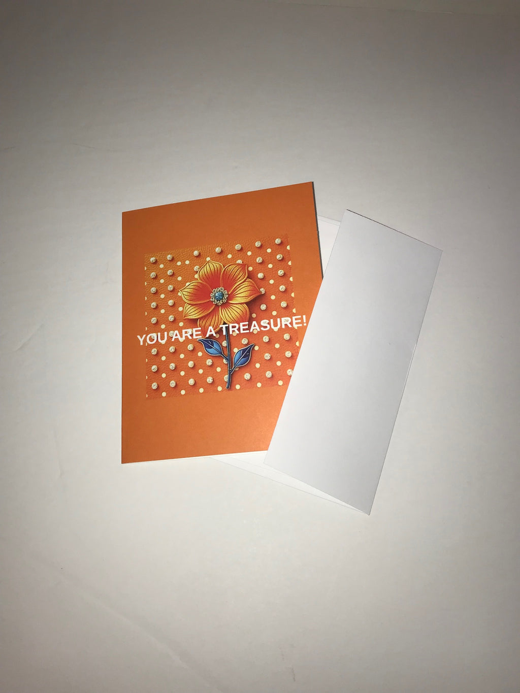 Front view of an orange and white polka dot note card with a white envelope.  Orange floral, flower design with crystals on white polka dots background and white envelope from the Luxe Note Cards Collection.  Shop at: www.andreaandme.com