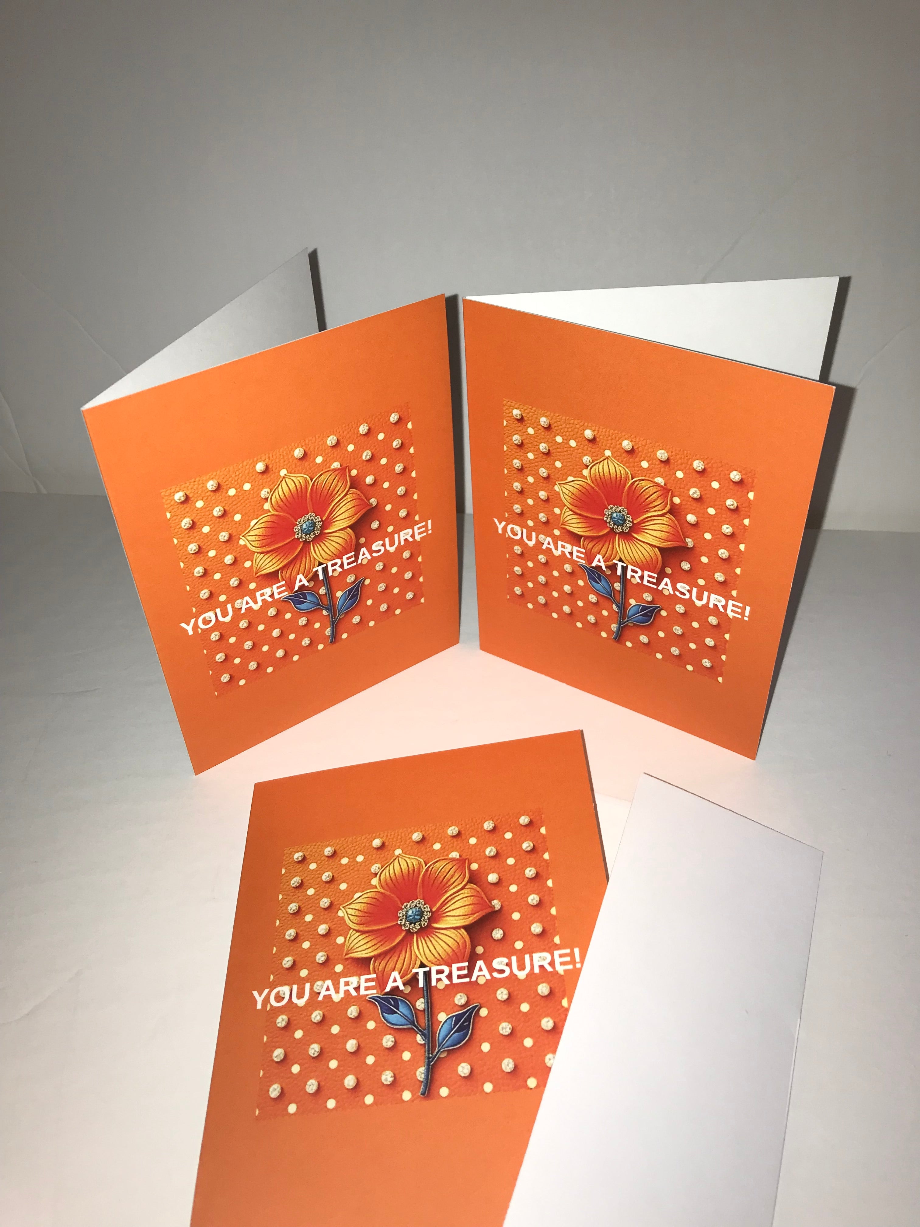 Front view of  three orange and white polka dot luxe note cards with  white envelopes that say ‘You are a Treasure’.  Orange flower with crystals on white polka dots background greeting/note cards.  Shop at:  www.andreaandme.com